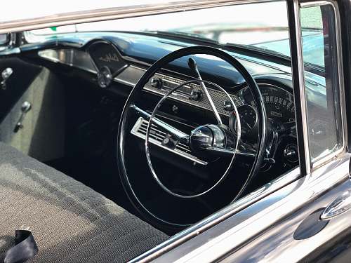 car black steering wheel in close up photography transportation