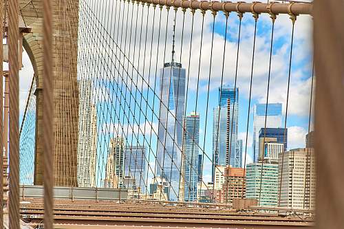 handrail brown bridge under blue sky building