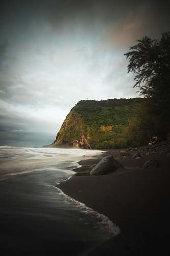 coast mountain beside beach nature