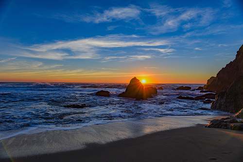 coast sunset in front of beach ocean