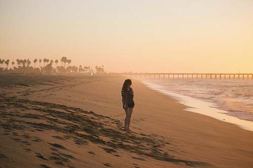ocean woman standing on seashore sea