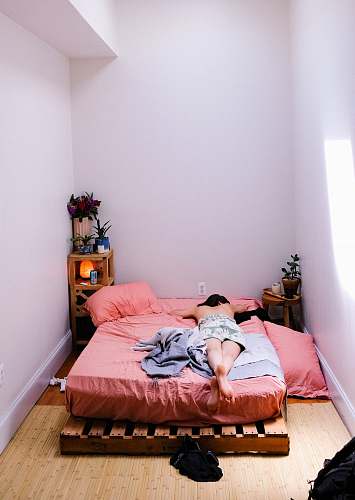 furniture person lying on pink mattress detroit