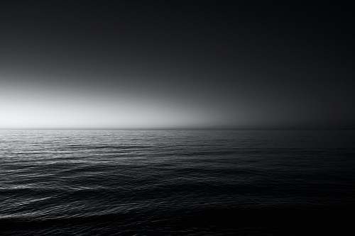grey grayscale photo of sea water