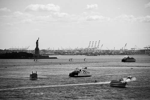 boat grayscale photo of ships on body of water vehicle