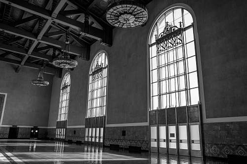 prison hallway with three large arch-shaped windows los angeles