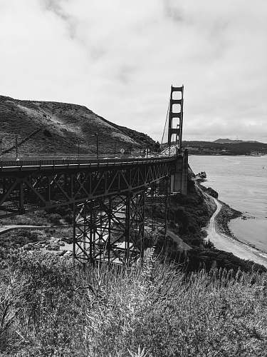building road leading to Golden Gate Bridge near shore bridge