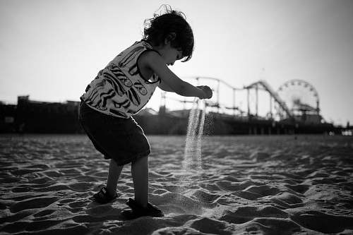 human toddler playing beach sand people