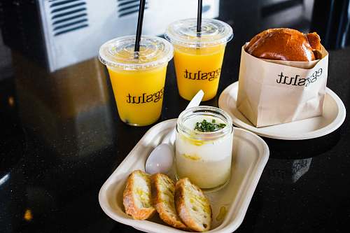 food two clear plastic cups filled with yellow liquid los angeles