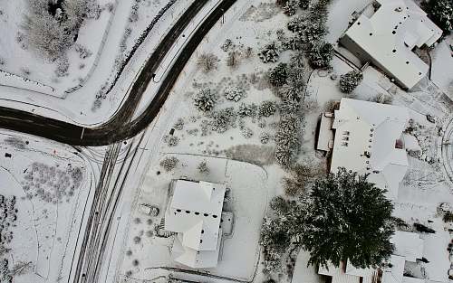 house aerial photography of houses coated with snow happy valley