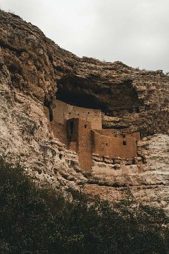 architecture architectural photography of brown and white mountain castle