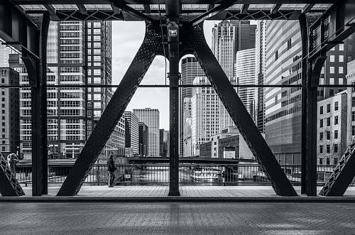 black-and-white architectural photography of metal buildings bridge