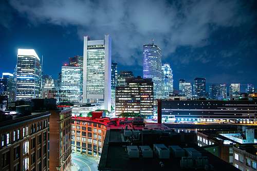 city buildings during night time downtown