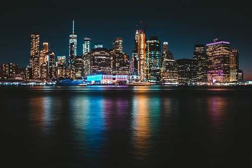 city city with lights turned-on during nighttime downtown