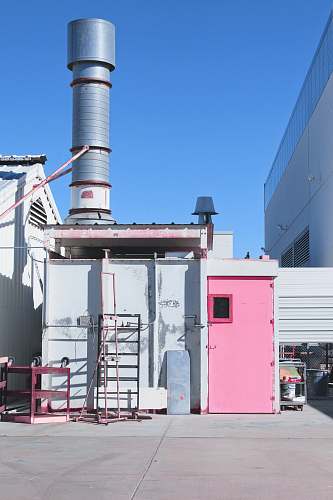 beacon gray metal shed with pink door power plant