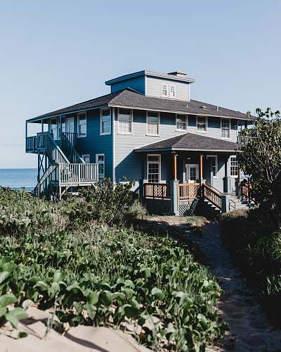 maui grey and brown wooden house during daytime outdoors