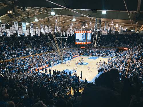 human group of people at basketball stadium person