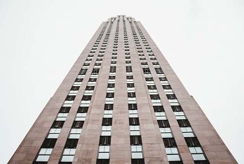 skyscraper high-angle photography of brown high rise building during daytime architecture
