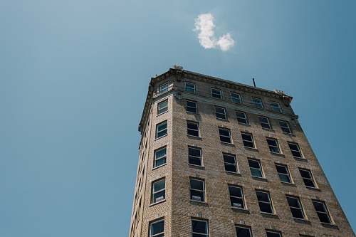 city low-angle photography of gray concrete building high rise