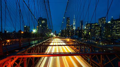 bridge timelapse photo of red bridge brooklyn bridge