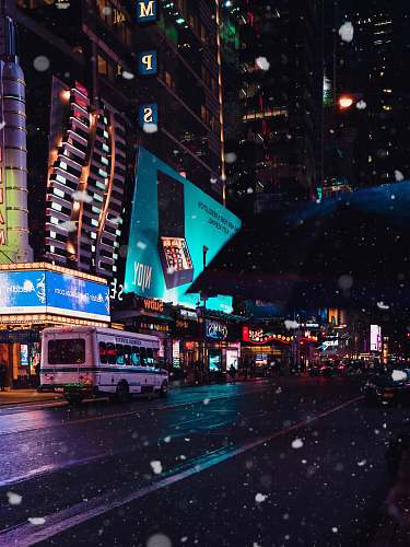 urban white bus in city street at night city