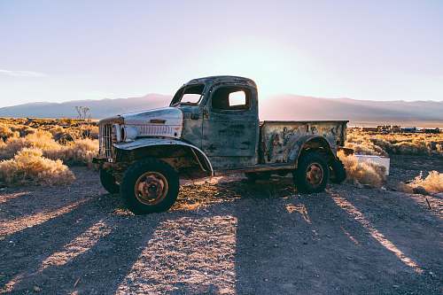 tractor gray single cab truck on brown farm transportation