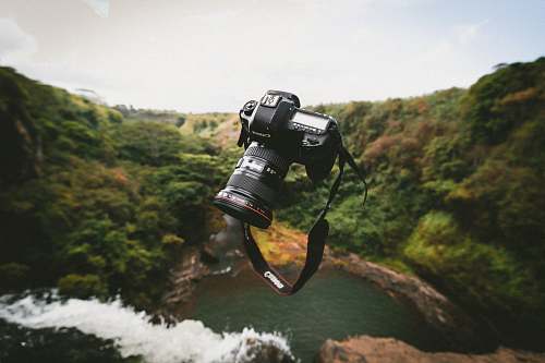 levitation trowed black Canon DSLR camera canon