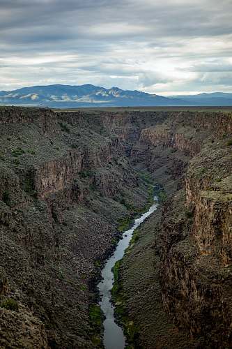 valley aerial photography of gray mountains nature