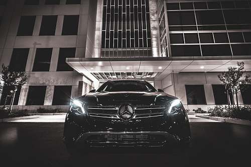 automobile black Mercedes-Benz near building vehicle