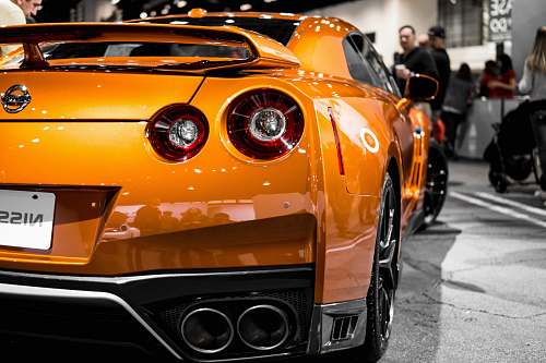 person gold Nissan sports car human