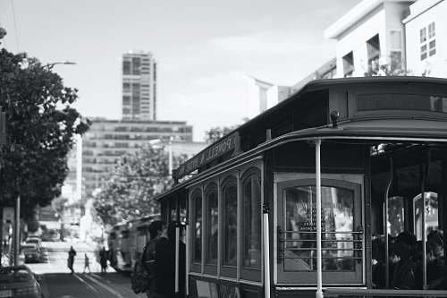 human grayscale photography of bus black-and-white