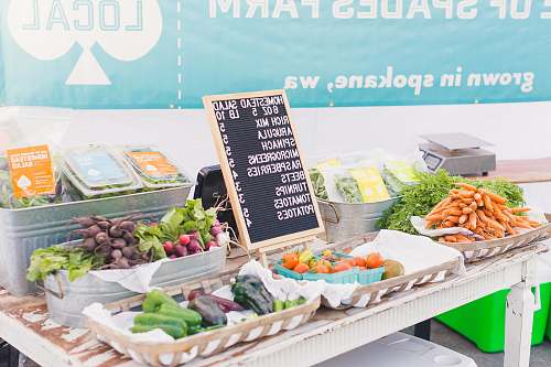 produce variety of vegetables with price sign on table flora