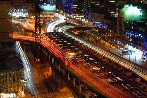 urban aerial view of roadway bridge during night time building