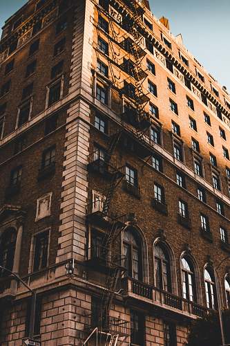 building low angle photo of brown building urban