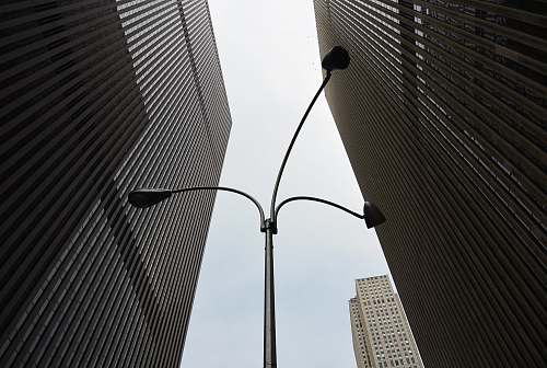 urban silver 3-lamp light post skyscraper