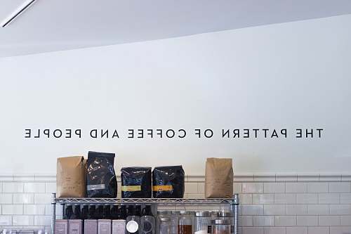 storage five assorted-brand coffee bags on stainless steel rack whistle stop grocery