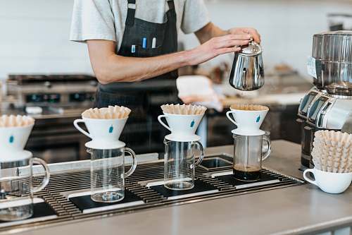 coffee man pouring on cup blue bottle coffee