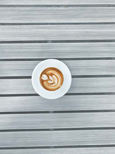beverage round white espresso coffee on grey striped surface drink