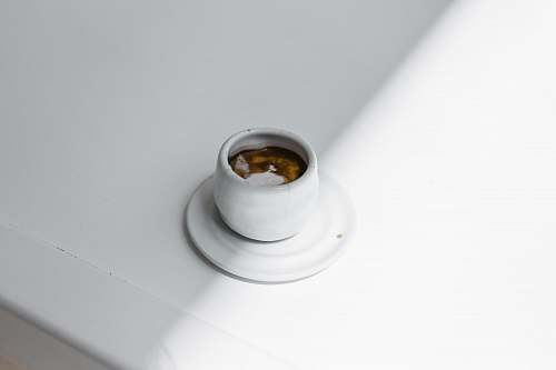 bottle white teacup on saucer ink bottle
