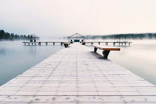 pier brown bench on brown wooden bridge bench