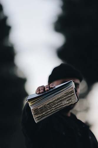human person holding book person