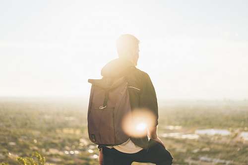 light man carrying backpack clothing
