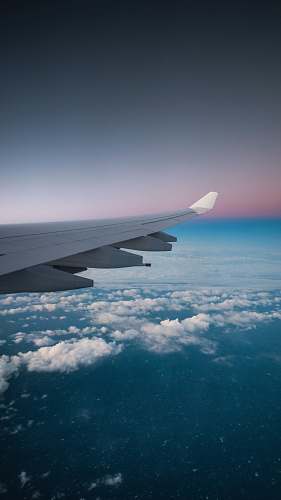 aircraft aerial photography of clouds and mountains airplane