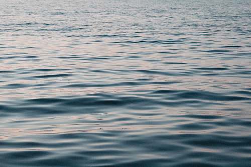 water body of water during daytime ripple