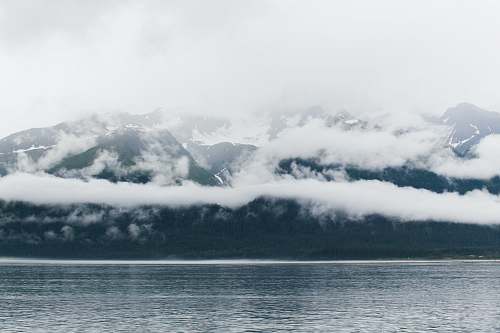 mountain cloudy sky covered mountain taken at daytime glacier