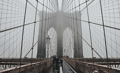 bridge people walking on Brooklyn Bridge building