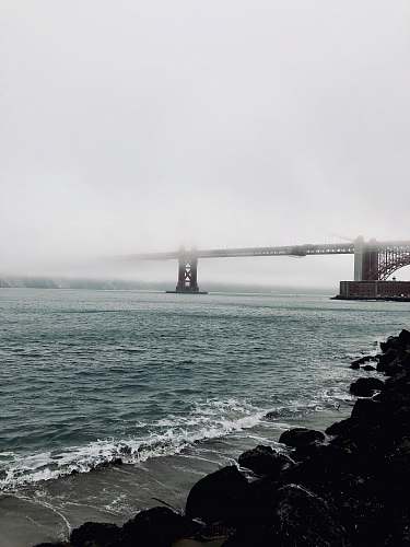 ocean photography of concrete bridge sea