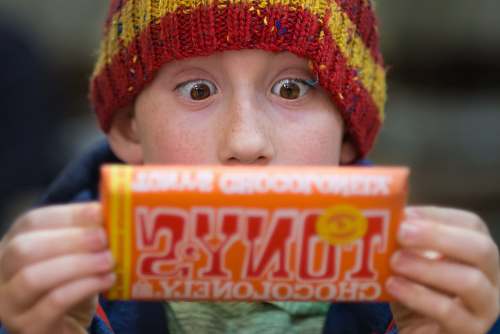 person boy holding Tony's chocoloney pack people