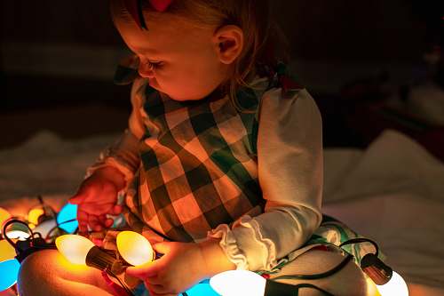 person girl holding string lights pascagoula