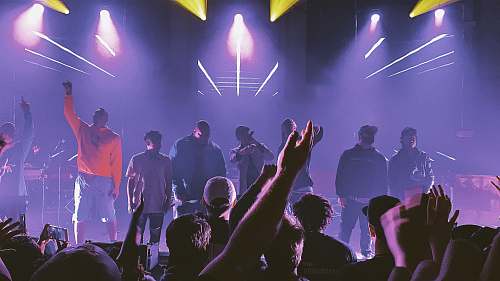 person group of people singing on the stage club