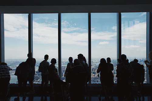 person group of people standing inside building new york